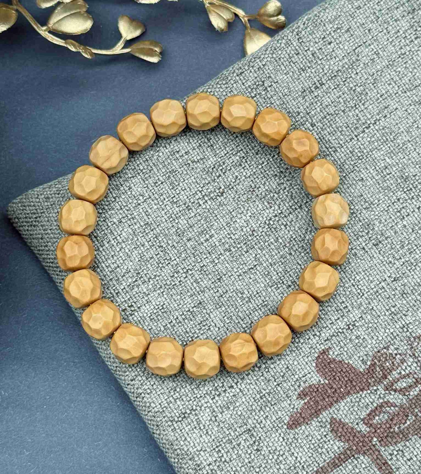 “Zakiram” Faceted Walnut Bracelet — Hand-Carved Echoes of Earth and Stillness