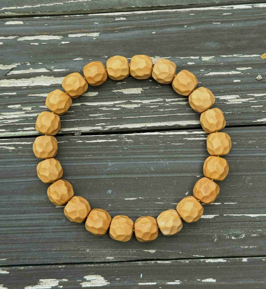 “Zakiram” Faceted Walnut Bracelet — Hand-Carved Echoes of Earth and Stillness