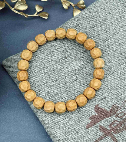 “Zakiram” Faceted Walnut Bracelet — Hand-Carved Echoes of Earth and Stillness
